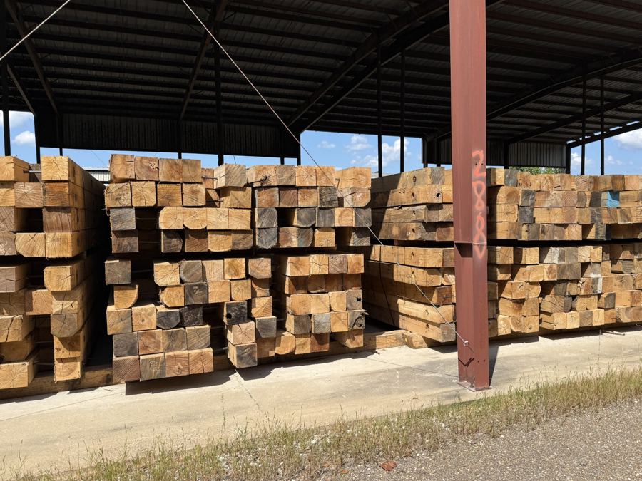 Stacks of 8 inch by 18 foot hardwood access mats at the Linden yard