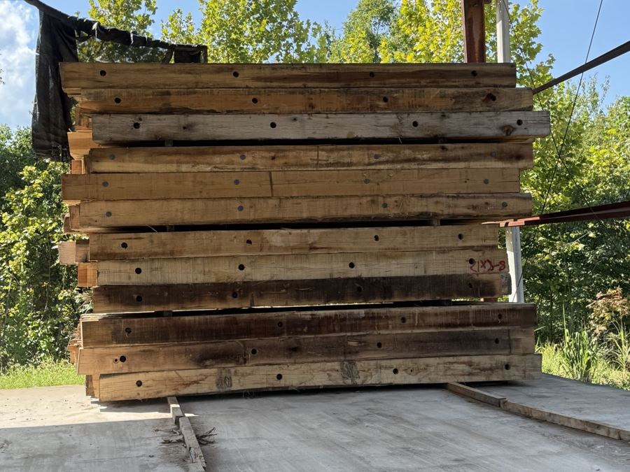 Stack of 12 inch hardwood crane mats with steel through-rods
